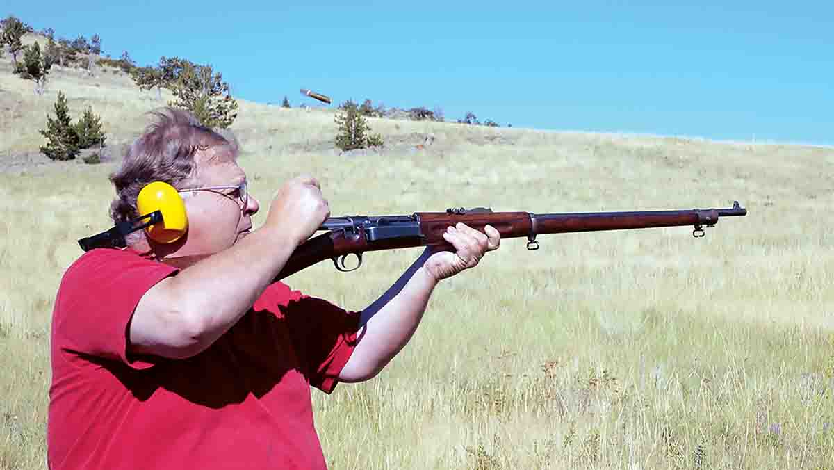 Mike firing his Model 1896 Krag 30 Army. Note the ejected cartridge in the air (see arrow).